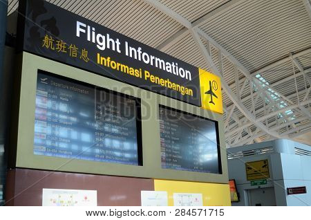 Bali, Indonesia- 14 Feb, 2019: Departure Flight Information At Ngurah Rai Airport In The Hall For Pa