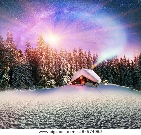 Climbing To Tourist Wild Alpine Mountain To An Abandoned Cabin-in Order To Illuminate The Snow-cover