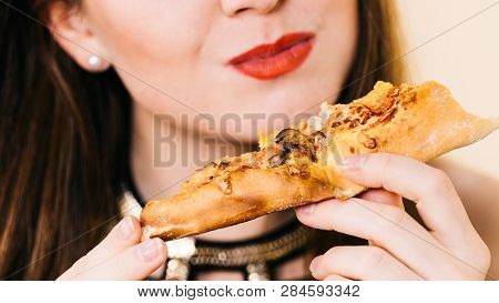 Young Woman Eating Hot Fresh Pizza Slice. Delicious Fast Food Meal. People, Italian Cuisine Concept.
