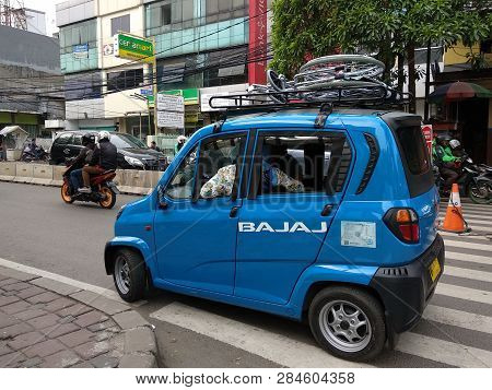 Jakarta, Indonesia - May 28, 2018: A Blue Bajaj Running On The Street In Karet District.