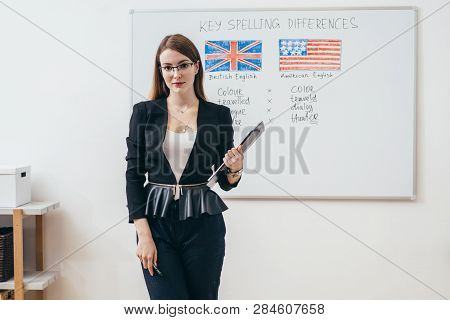 Female Teacher Looking At Camera. English Language School.