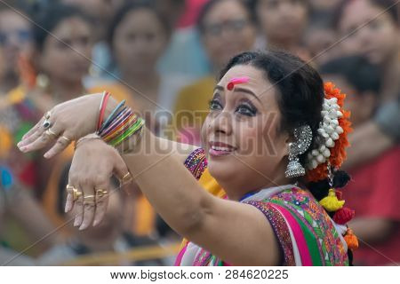 Kolkata , India - March 1, 2018: Girl Dancer, Dressed In Sari - Traditional Indian Dress And Palash 