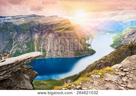 Trolltunga - Famous Landmark In Norway. Panoramic View Of Fjord Lake And Mountains, Summer Landscape