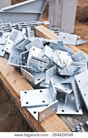 Part Of The Building Structure Of Galvanized Parts. Galvanized Parts On A Construction Site In Rainy