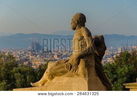 Statue In Front Of National Art Museum Of Catalonia. Viewpiont On The Sagrada Familia Cathedral. Jun