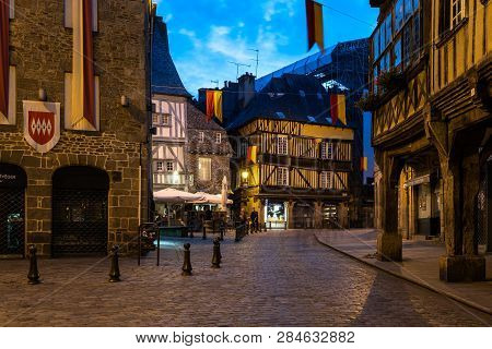 Dinan, France - July 23, 2018: Old Cobblestoned Street With Medieval Houses  In City Centre Of Dinan
