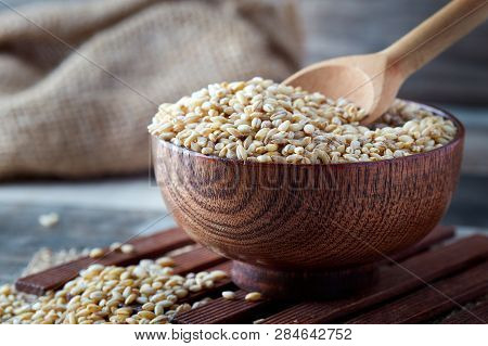 Raw Barley Grain (hordeum Vulgare) In Wooden Bowl