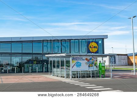 Mouscron,belgium-february 17,2019: View Of Lidl Supermarket And Logo.lidl Stiftung & Co. Kg  Is A Ge