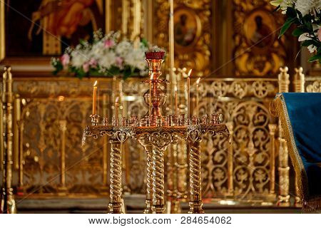 Candil Inside The Church With Burning Candles