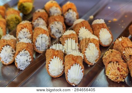 Freshly Made Traditional Italian Cannoli With A Variety Of Fillings On Display At A Bakery In Ventim