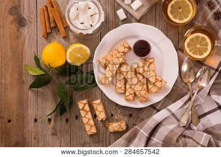 Puff Pastry Cookies With Jam On White Dish.