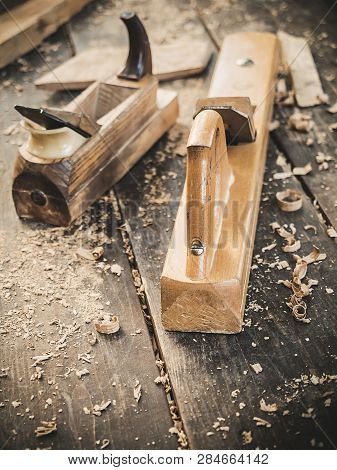 Old Woodworking Hand Tool: Wooden Plane, Chisel And In A Carpentry Workshop On Dirty Rustic Table Co