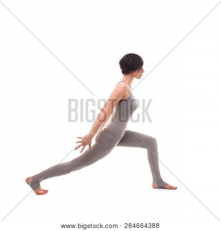 Young Beautiful Woman Yoga Posing On Isalated White Studio Background