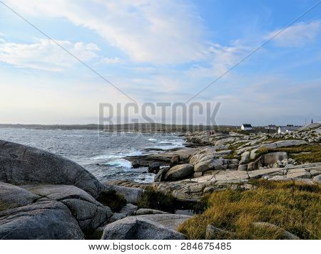 The Rugged Coast Off Of Peggys Peggys Cove Lighthouse, An Active Lighthouse And An Iconic Canadian I