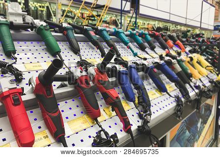 Angle Grinder Shelf In The Repair Shop. Large Selection Of Angle Grinder On The Store Shelf. Tools F