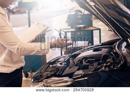 This Career Man Saleman Business Inspection Writing Note On Notepad Or Book, Paper With Car Blurry B