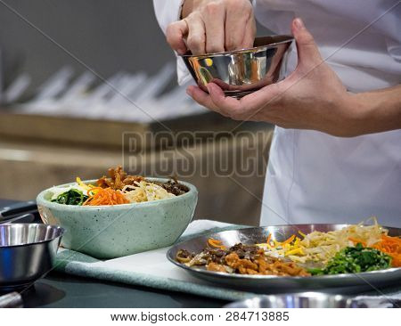 Bibimbap, Traditional Korean Cuisine Bibimbap, Chef Preparing Korean Food, Chef Cooking In Kitchen