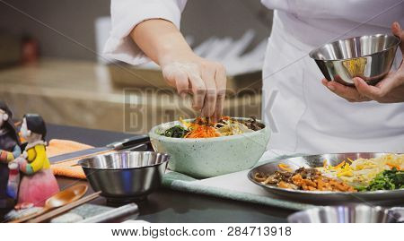 Bibimbap, Traditional Korean Cuisine Bibimbap, Chef Preparing Korean Food, Chef Cooking In Kitchen