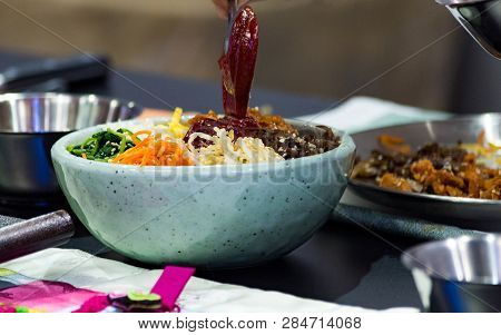 Bibimbap, Traditional Korean Cuisine Bibimbap, Chef Preparing Korean Food, Chef Cooking In Kitchen