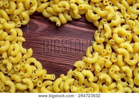 Macaroni Pasta Lover, Dry Macaroni Pasta Texture Background With Heart Shape Copy Space. Traditional