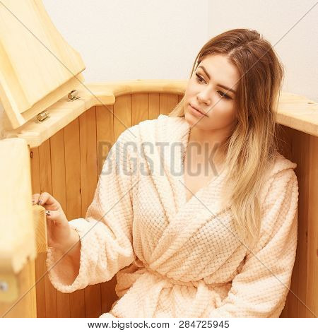 Barrel Cedar. Wellness Spa Sauna. Aromatherapy Treatment. Young Beauty Woman. Girl Face