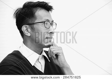 Asian Adult With Glasses Thinking Looking Far Sight For Vision Business Man.