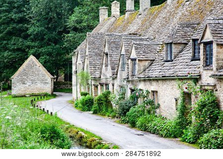 traditional Cotswold cottages in England, UK. Bibury is a village and civil parish in Gloucestershire, England