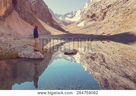 Beautiful serene lake in  Fanns mountains (branch of Pamir) in Tajikistan.