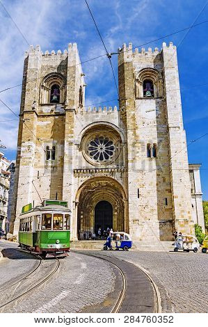 Lisbon Cathedral In Lisbon, Tram On Lisbona Street.portugal