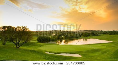 Panoramic View Of Water Hazards On A Fairway Golf Course