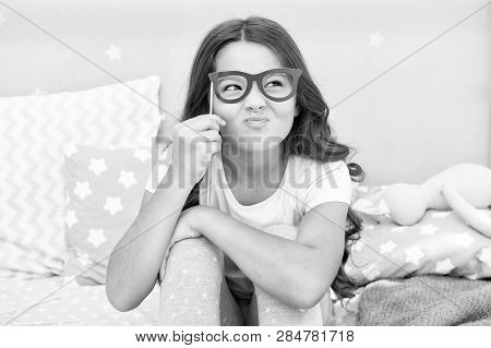 An Intellectual Look. Happy Small Girl. Small Girl Hold Fake Glasses On Face. Happy Childhood. Happy