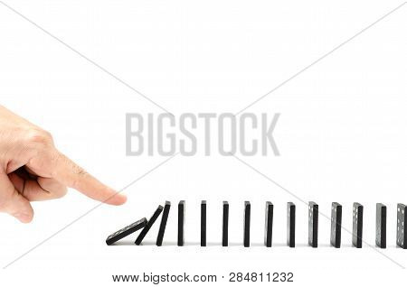 Finger, Human Hand Drops The Bones Of Dominoes On A White Background. Fall, Collapse, Coercion, Copy