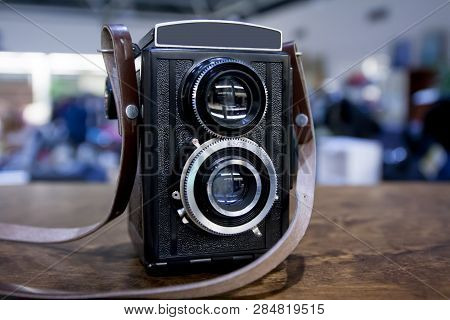 Vintage Twin Lens Camera On The Table.