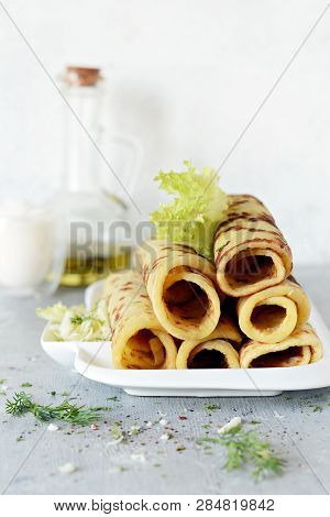 Norwegian Potato Pancakes Lefse On A Light Background With Cheese And Greens. Traditional Scandinavi