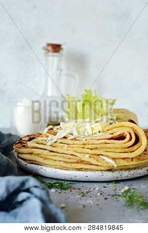 Norwegian Potato Pancakes Lefse On A Light Background With Cheese And Greens. Traditional Scandinavi