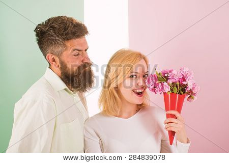 Woman Enjoy Fragrance Bouquet Flowers. Man With Beard Takes Care About Girlfriend Happiness. Lady Li