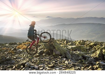 Alpine Landscape With A Biker