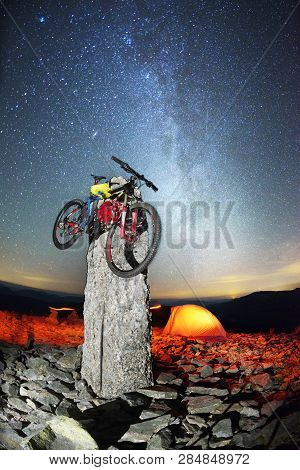 Bike On A Stone Pillar Tops At Night