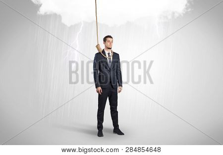 Young businessman trying to suicide with pointing hands concept