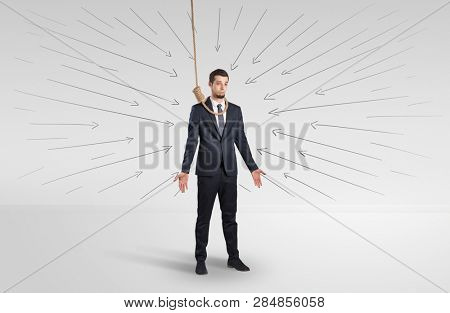 Hopeless young businessman trying to suicide with question signs concept