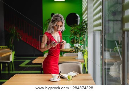 Photo On The Camera Of A Mobile Phone. Beautiful Layout Of Items For The Photo.