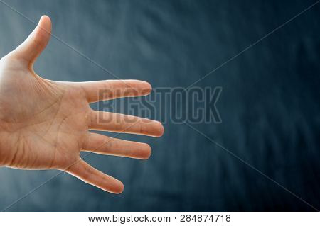 Adult Hand With Raynaud's Syndrome - Phenomenon. Close Up Hand With Fingers On Dark Background With 