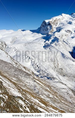 Top View Of Alps Glacier Gornergletcher With Monte Rosa (dufourspitze) Under Sunny Blue Sky, Zermatt