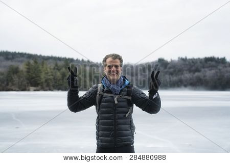 A Middle Aged Caucasian Man Posing Outside In A Winter Landscape At Burr Pond State Park In Torringt
