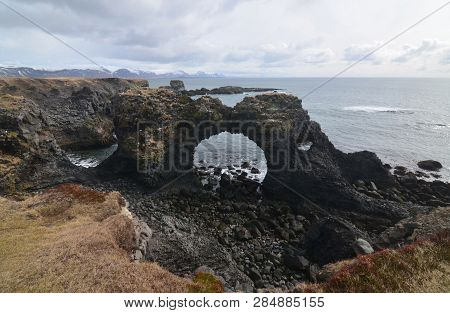 Arnarstapi's Arch Rock On The Coast Of Snaefelsnes Peninsula