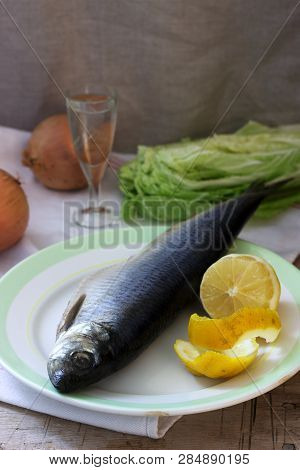 Still Life Of Herring, Lemon, Onion And Vodka. Rustic Style.