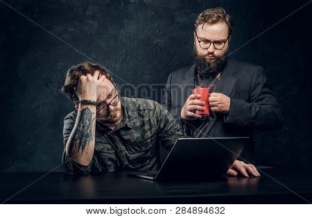 Two Programmers Are Thinking Hard, Trying To Find A Solution To The Problem In Office Against The Ba
