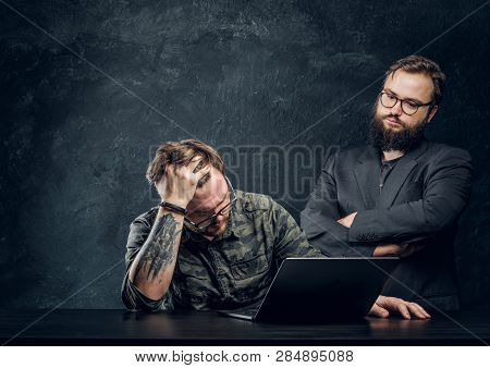 Two Programmers Are Thinking Hard, Trying To Find A Solution To The Problem In Office Against The Ba