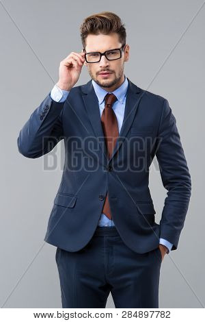 Elegant Man Wear Dark Siut And Glasses