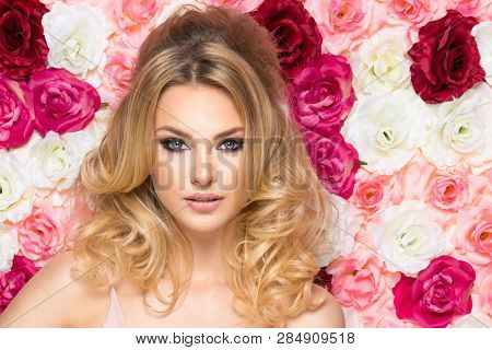 Beauty Happy Model Girl With Flowers. Hair Like Brigitte Bardot